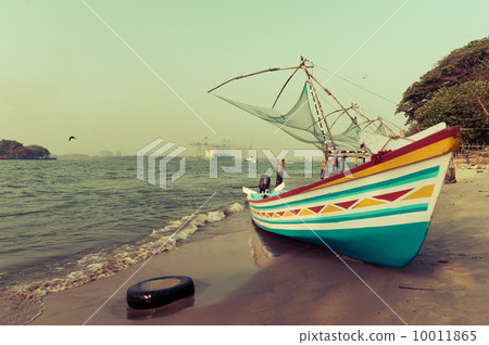 Ocean coast landscape with traditional Indian boat 10011865