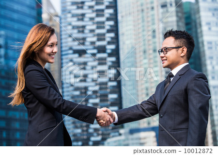 Young business executives shaking hands Young business executives shaking hands 10012872