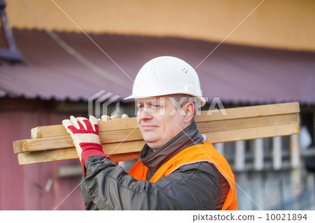 Carpenter with boards on their shoulders 10021894