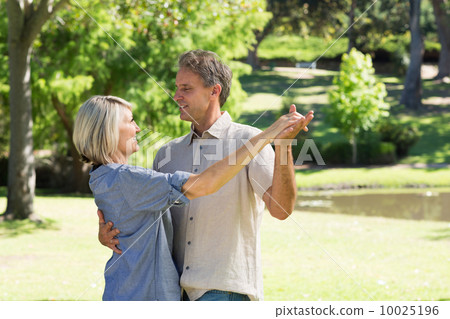 Couple dancing in countryside 10025196
