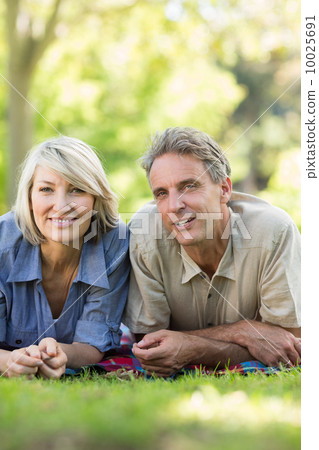 Couple relaxing in park Couple relaxing in park 10025691