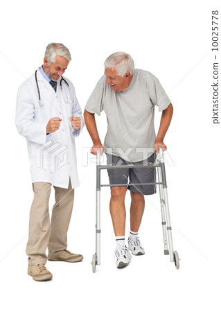 Doctor with senior man using walker 10025778