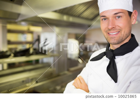 Closeup of a smiling male cook in kitchen 10025865