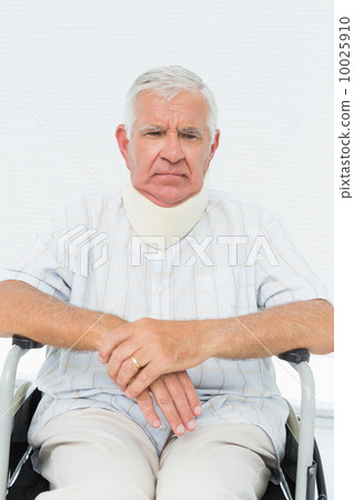 Senior man sitting in wheelchair with cervical collar Senior man sitting in wheelchair with cervical collar 10025910