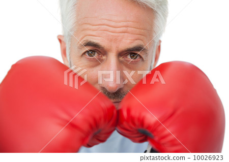 Close-up portrait of a determined senior boxer 10026923