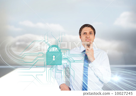 Confused businessman with lock and circuit board graphic 10027245