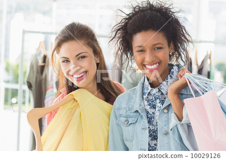 Portrait of two happy young women with shopping bags Portrait of two happy young women with shopping bags 10029126