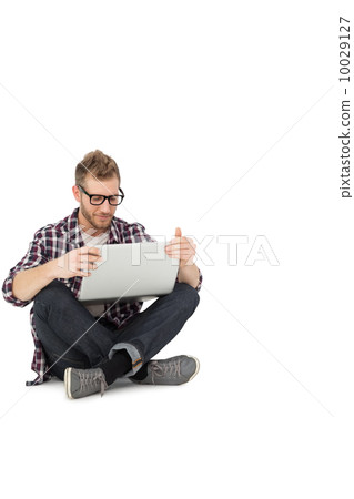 Full length of a young man with laptop Full length of a young man with laptop 10029127