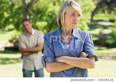 Upset couple in parkland Upset couple in parkland 10029128