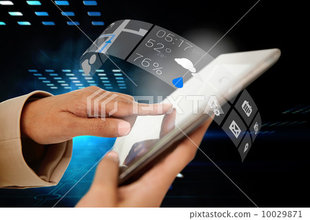 Businesswoman touching tablet with app interface Businesswoman touching tablet with app interface 10029871
