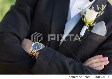 Midsection groom with arms crossed Midsection groom with arms crossed 10030103