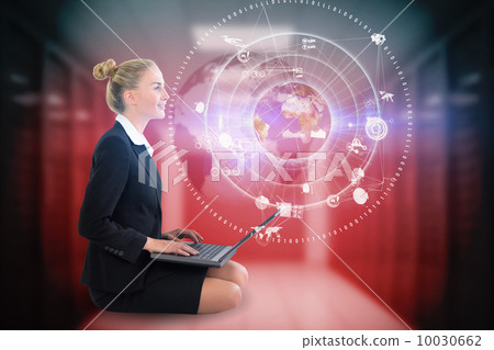 Blonde businesswoman sitting using laptop with earth interface 10030662