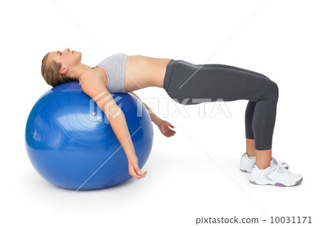 Fit young woman exercising with fitness ball Fit young woman exercising with fitness ball 10031171