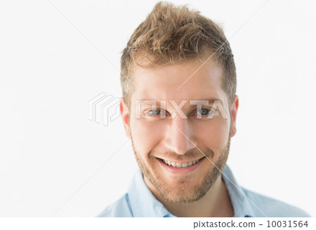 Confident young man smiling at camera 10031564