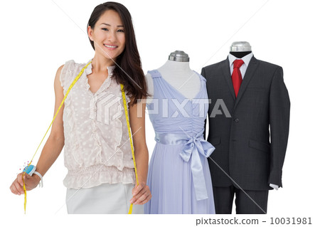 Portrait of a female fashion designer and mannequins 10031981