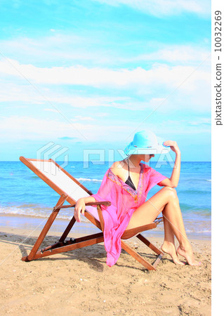 Relaxing on the beach 10032269