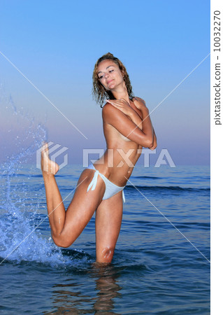 young woman topless in water 10032270