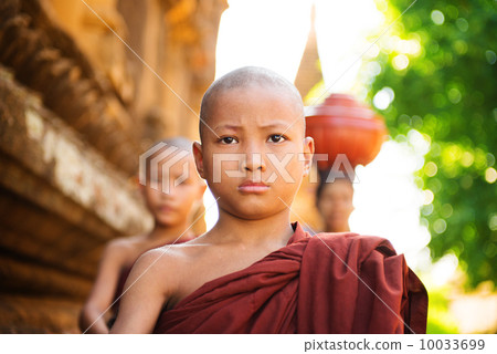 Young Buddhist monks walking morning alms 10033699