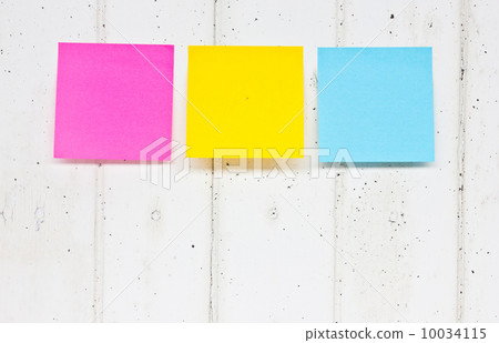colorful sticky notes on old wooden board 10034115
