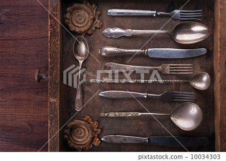 Old cutlery in an old wooden box 10034303