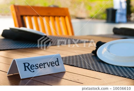 Reserved sign on a table 10036610