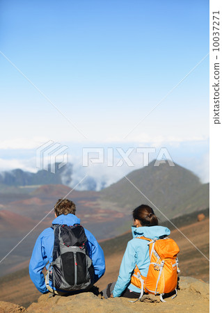 Hikers - people hiking sitting enjoying summit top 10037271