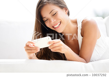 Smartphone woman using app smiling happy 10037292