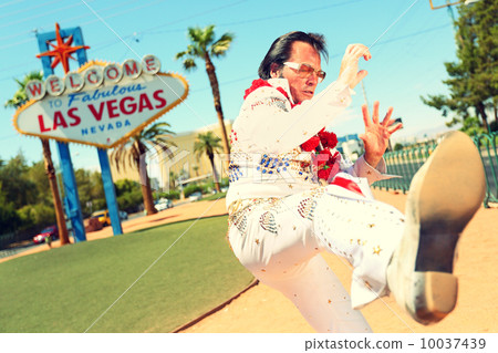 Elvis look-alike impersonator and Las Vegas sign 10037439