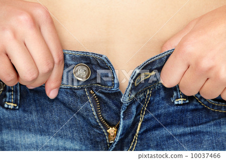 Weight gain woman getting dressed wearing jeans 10037466