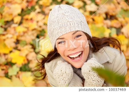 Autumn woman happy with colorful fall leaves Autumn woman happy with colorful fall leaves 10037469