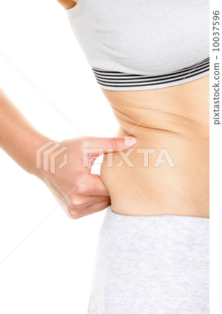 Weight gain - woman gaining weight touching fat 10037596