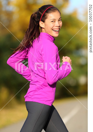 Asian woman running - female runner in autumn 10037702