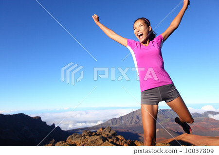 Success winner fitness runner woman jumping Success winner fitness runner woman jumping 10037809