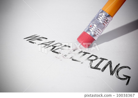 Pencil erasing the word We are hiring 10038367