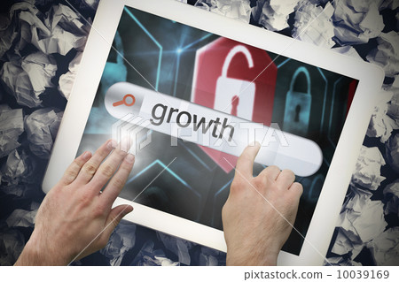 Hand touching growth on search bar on tablet screen 10039169
