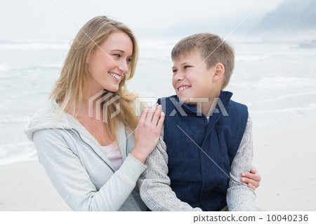 Cute boy with mother at beach Cute boy with mother at beach 10040236