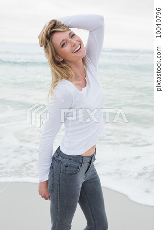 Portrait of a smiling casual woman at beach Portrait of a smiling casual woman at beach 10040796