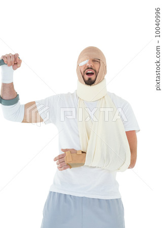 Cheerful young man with broken hand cheering 10040996