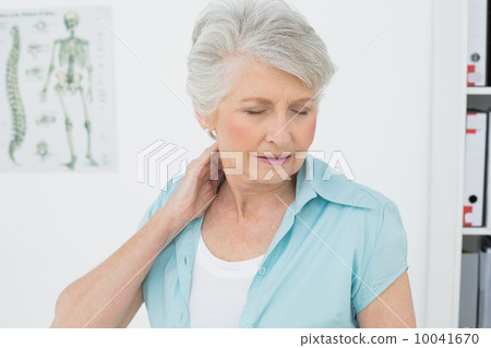 Senior woman suffering from neck pain Senior woman suffering from neck pain 10041670