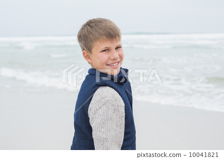 Portrait of a cute smiling boy at beach Portrait of a cute smiling boy at beach 10041821