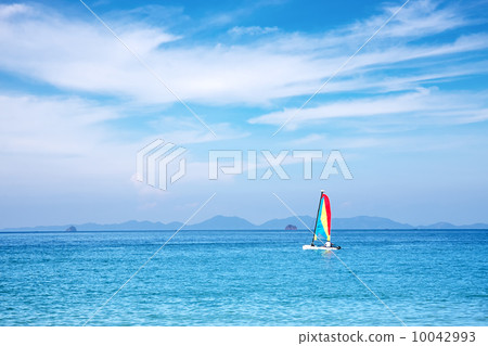sailboat on the horizon on a sunny day 10042993