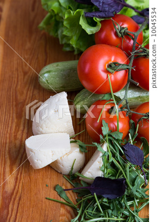 background from mixed vegetables with wood board 10045534
