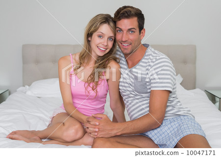 Portrait of a happy relaxed couple in bed Portrait of a happy relaxed couple in bed 10047171
