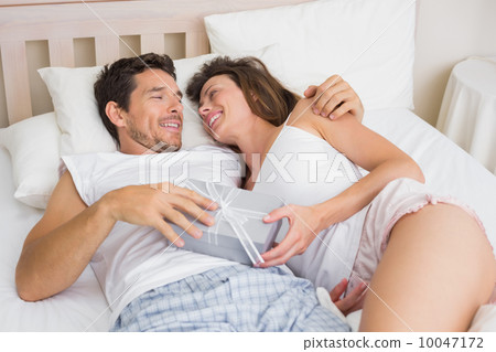 Relaxed couple sleeping together in bed 10047172