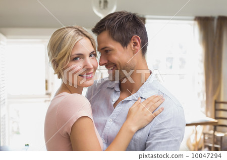 Happy loving young couple at home Happy loving young couple at home 10047294