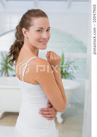 Portrait of a beautiful young woman in bathroom 10047608