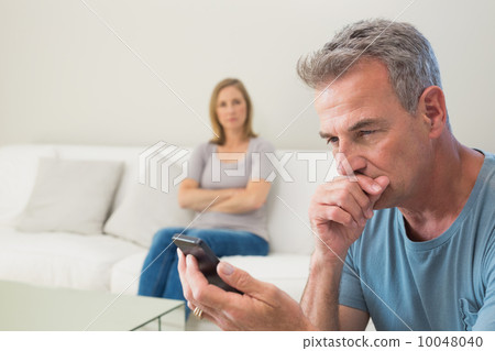 Unhappy couple not talking after an argument at home 10048040