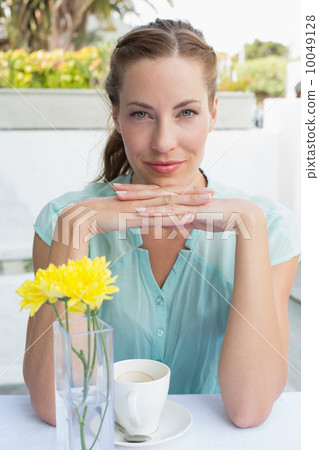 Portrait of a beautiful woman drinking at café Portrait of a beautiful woman drinking at café 10049128