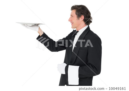 Waiter carrying tray against white background Waiter carrying tray against white background 10049161