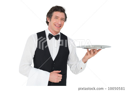 Happy waiter holding tray against white background Happy waiter holding tray against white background 10050581